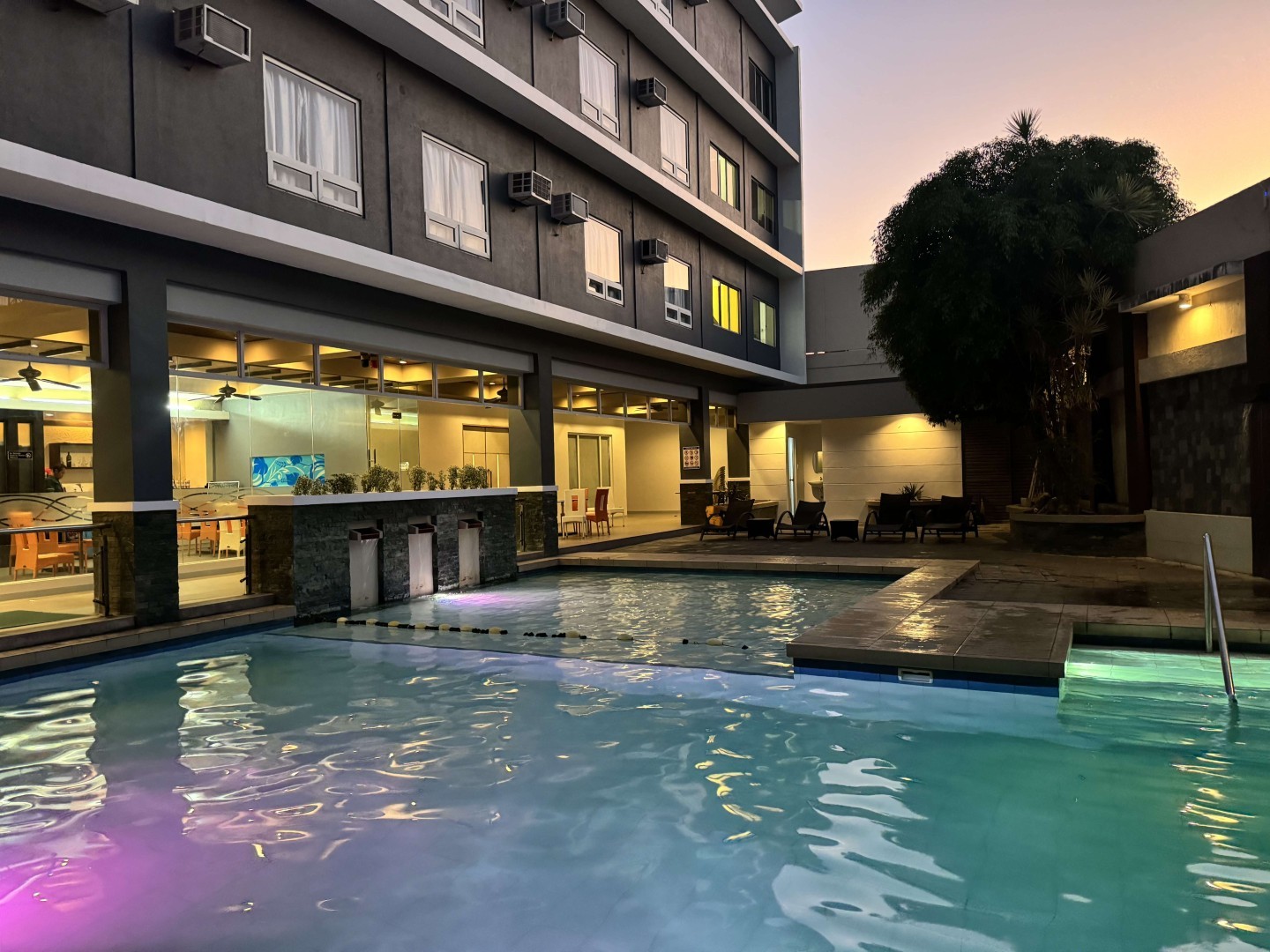Circle Inn Hotel & Suites Iloilo City Center — outdoor pool, restaurant, and hotel amenities